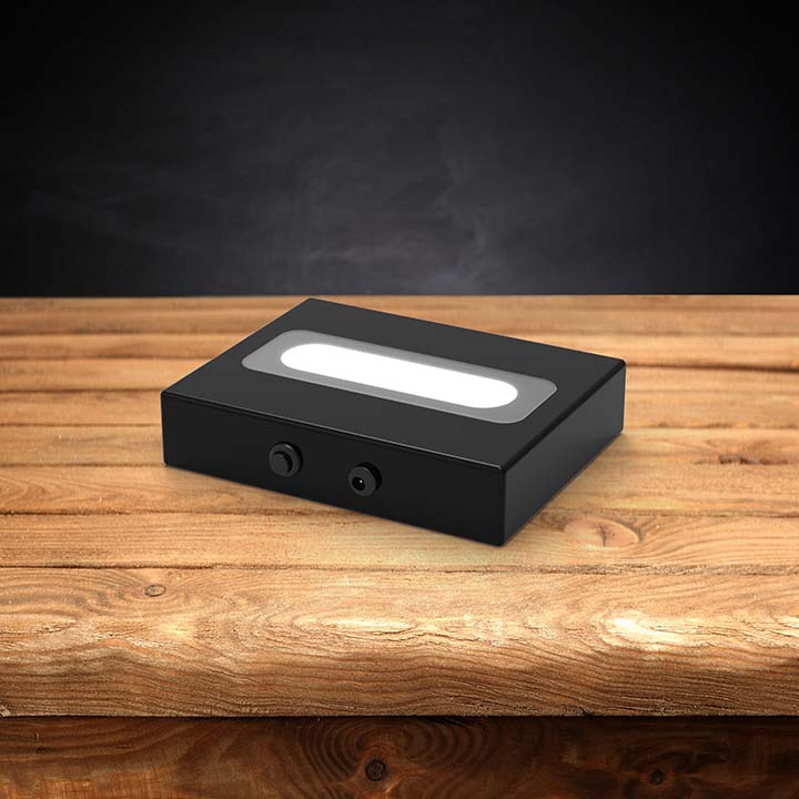 Wood LED light base with a dark background