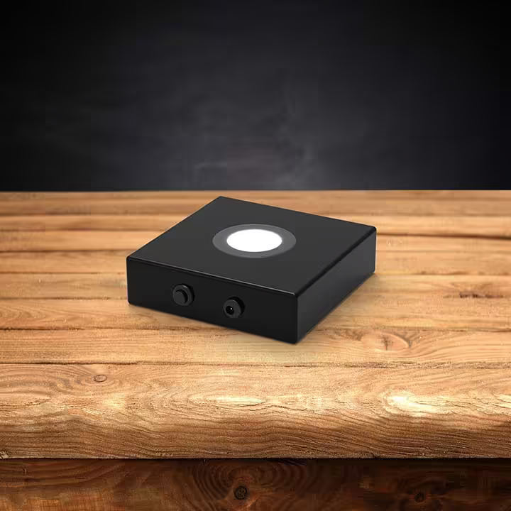 Wooden LED light base with a dark background