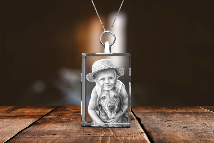 Picture of a kid and his dog engraved inside a 2D photo crystal rectangle necklace