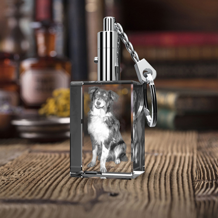 A dog image engraved inside a 2D crystal rectangle keychain